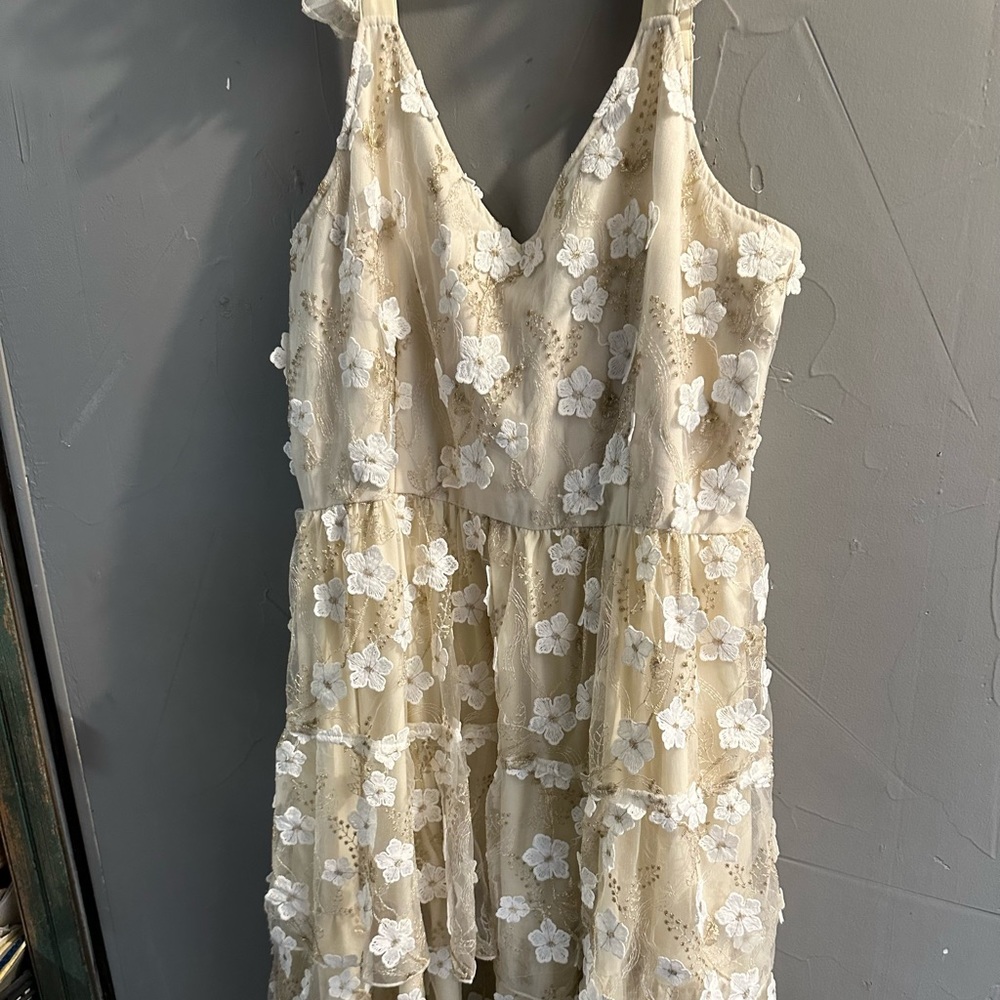 Large floor length floral dress with ruffle sleeves